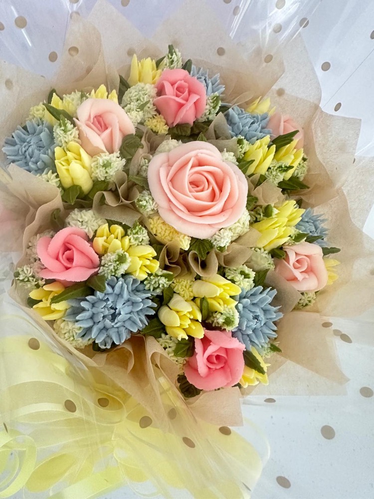 7 Deluxe cupcake bouquet with pink roses, yellow tulips and blue thistle buttercream flowers