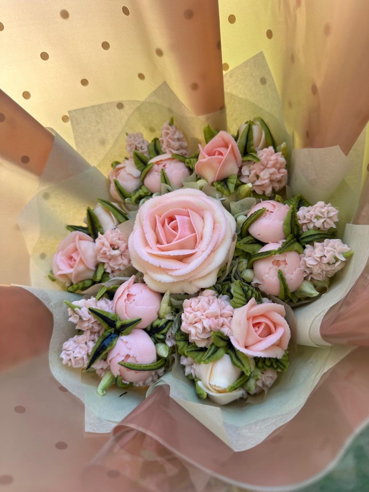 7 Deluxe cupcake bouquet of blush roses and peonies wrapped in cream tissue paper