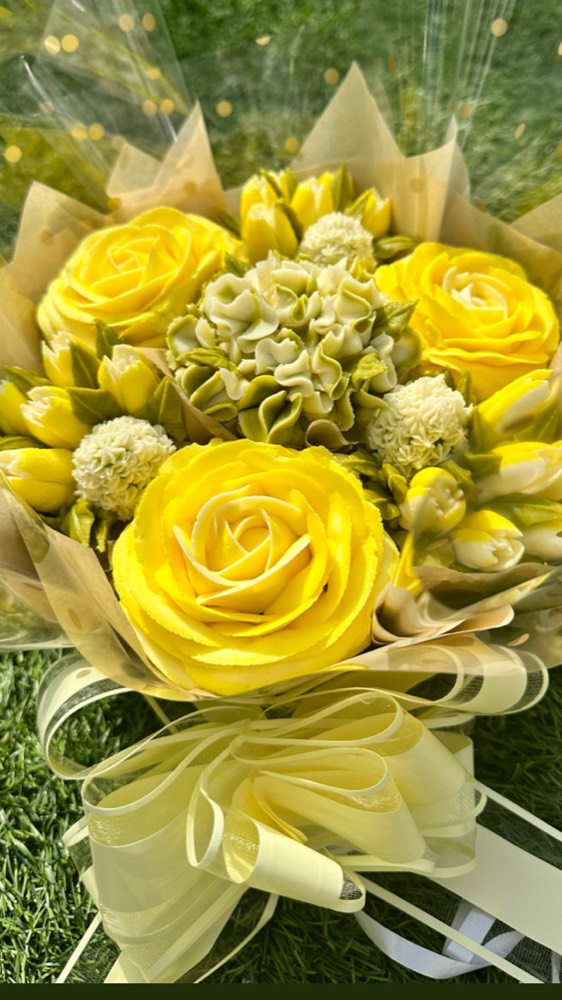 7 Deluxe cupcake bouquet with bright yellow buttercream roses and tulips