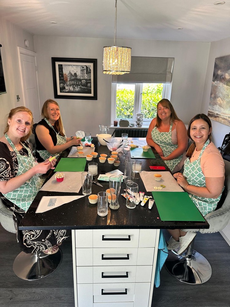 Emma teaching a buttercream flower piping class